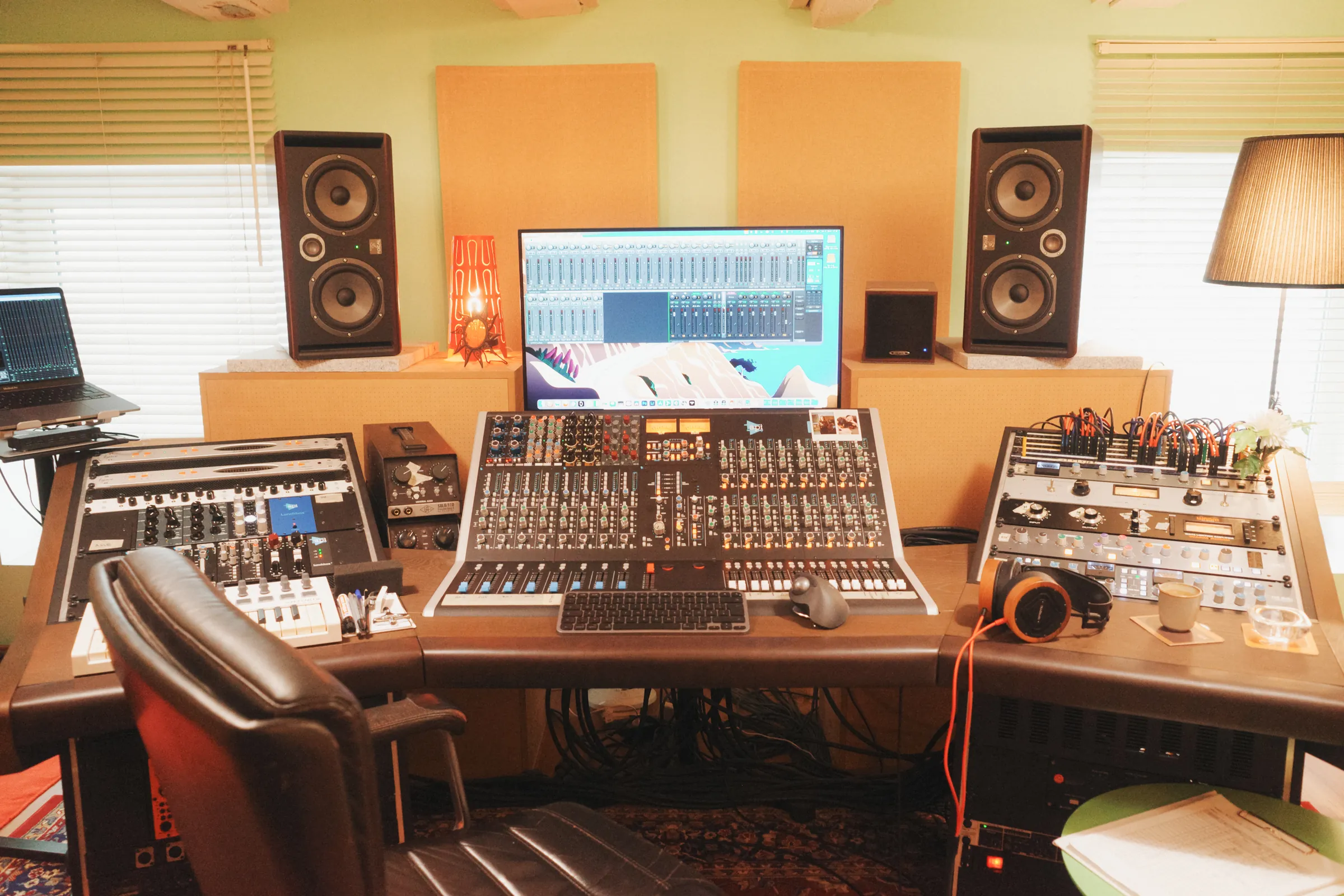 The console from the front, monitors left and right, the screen in between, the outboard gear in the racks beside it.